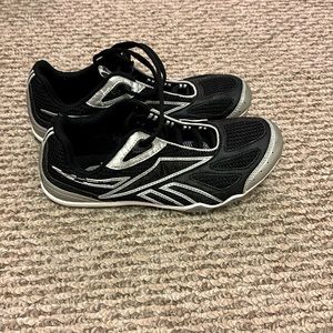 Reebok running shoes. Spikes are missing on right shoe. Like new condition.